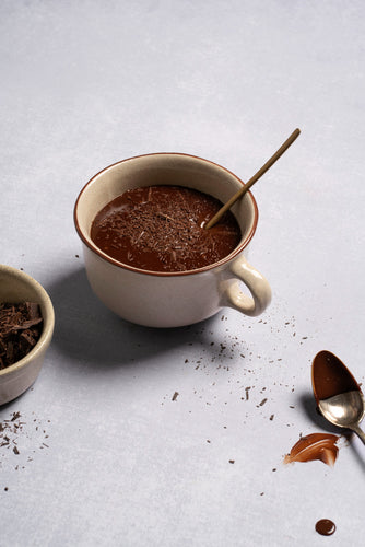 A warm cup of Healthy Hot Chocolate, featuring a rich, creamy texture with a nourishing blend of cocoa and wholesome ingredients for a guilt-free, comforting treat.
