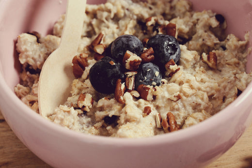 A bowl of Microbiome Friendly Oatmeal, topped with fresh fruits and seeds, offering a wholesome, gut-supporting breakfast option.