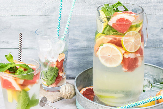 A refreshing glass of Citrus Mint Detox Water, featuring vibrant slices of lemon, lime, and fresh mint leaves, perfect for hydration and detoxification.